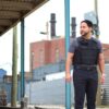 A man looking at the right side while wearing a bulletproof