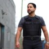A standing man looking away