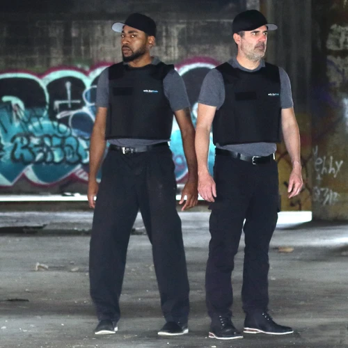 two men wearing bulletproof vests