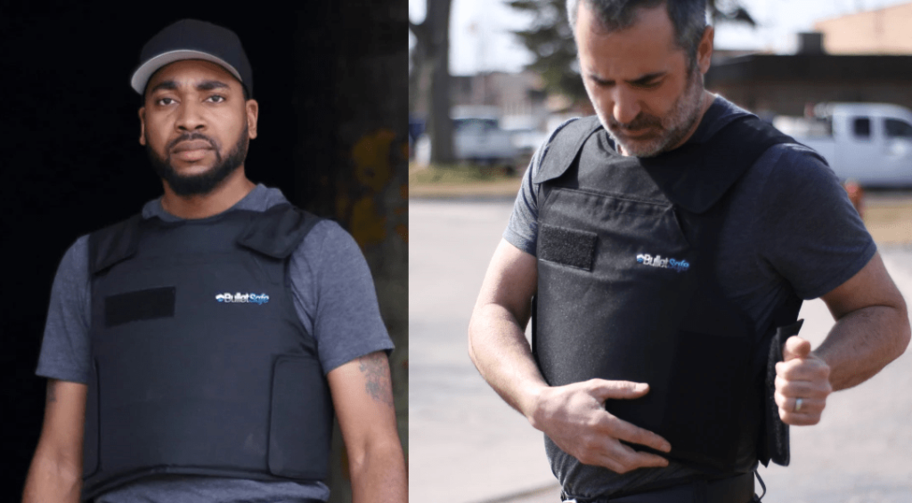 two persons wearing bulletproof vests