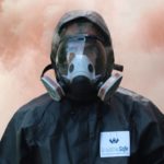 man wearing Breathesafe Respirator with brown smoke behind