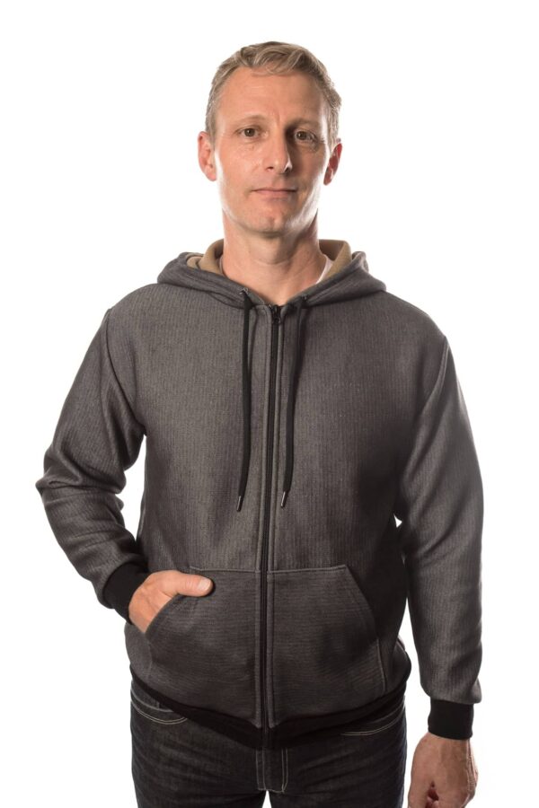 Man wearing SWX stab proof hoodie with one hand in pocket