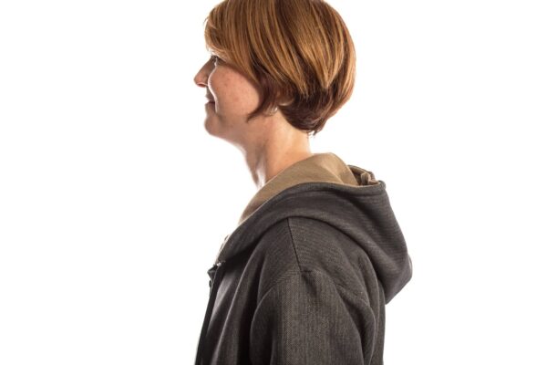 side view of a woman wearing SWX stab proof hoodie
