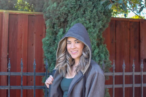 smiling woman wearing SWX stab proof hoodie
