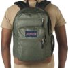 Man wearing Muted green plain weave JanSport Bulletproof Backpack front view