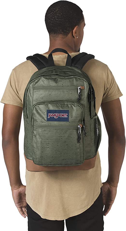 Man wearing Muted green plain weave JanSport Bulletproof Backpack front view