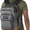Man wearing Black & White Herringbone JanSport Bulletproof Backpack back view
