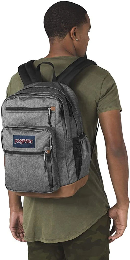 Man wearing Black & White Herringbone JanSport Bulletproof Backpack back view