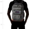 Man wearing Black & White Herringbone JanSport Bulletproof Backpack back fit illustration
