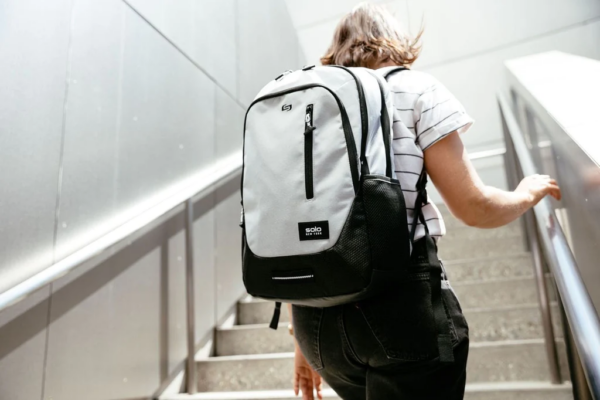 Woman wearing Bulletproof Solo New York Varsity Region Backpack