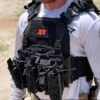 Man wearing black Real World Tactical Special Edition Shadow Plate Carrier front view