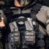 Man wearing black Real World Tactical Special Edition Shadow Plate Carrier front view